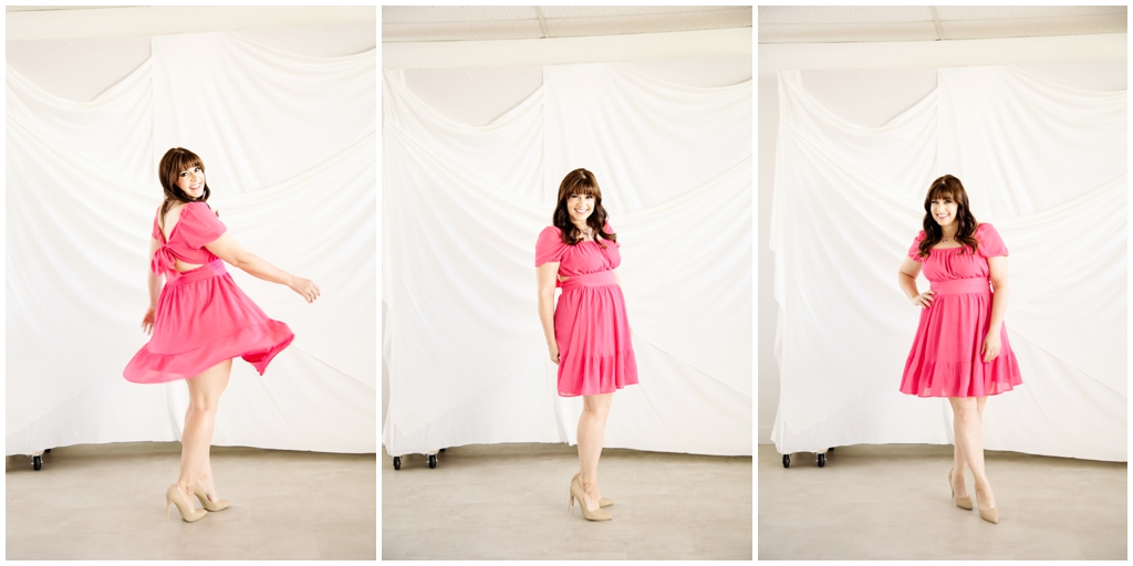 Female Life coach dancing in pink dress in Scottsdale Photography Studio