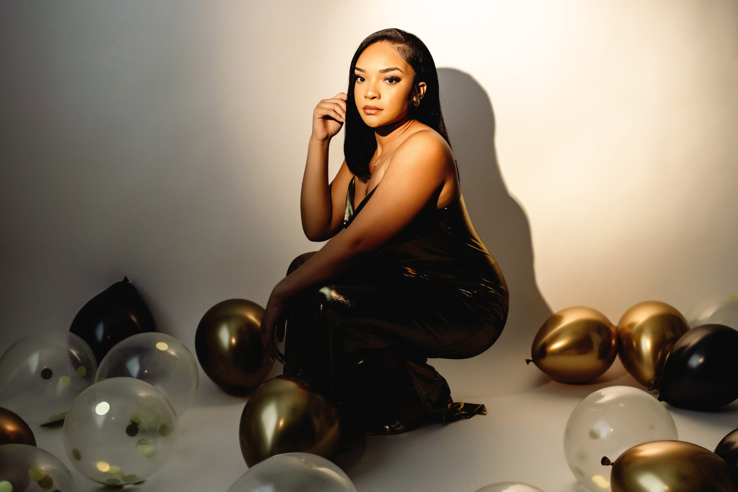 Teen celebrating 18th birthday with spotlight photoshoot in Phoenix AZ